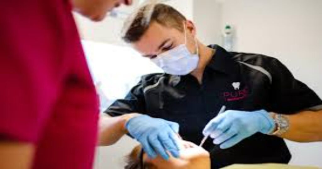 A dentist examining a patient's teeth