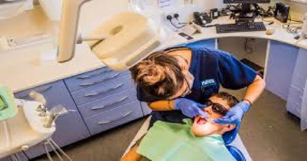 A dentist examining patient's teeth